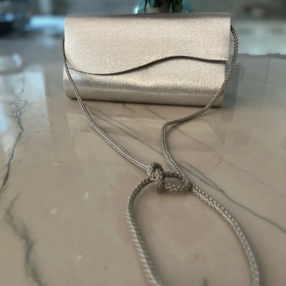 Fancy silver box purse with magnetic button closure one pocket inside